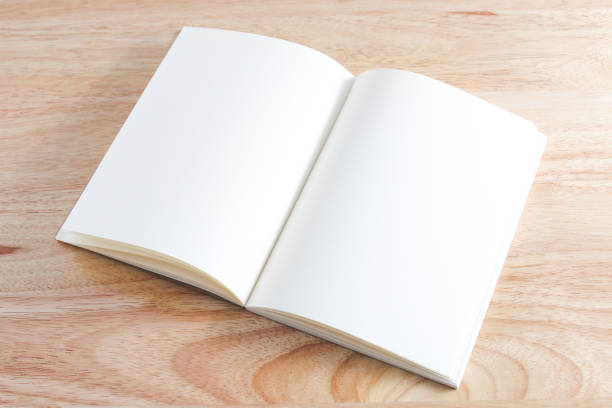 istock Recycled paper book on wooden background 1424457844