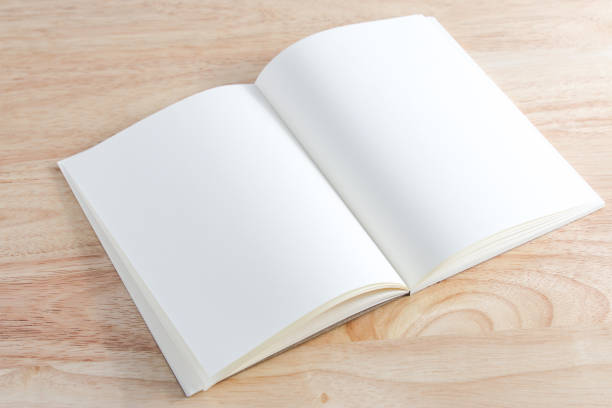 istock Recycled paper book on wooden background 1424459175