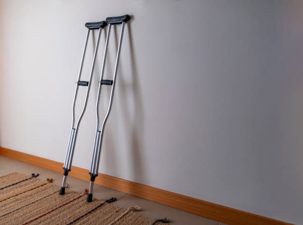 crutches in front of the wall, front view