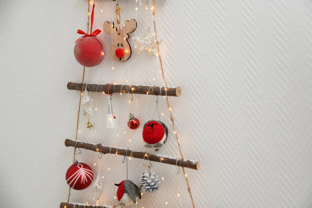 istock Handmade wooden Christmas tree hanging on the wall 1424471650