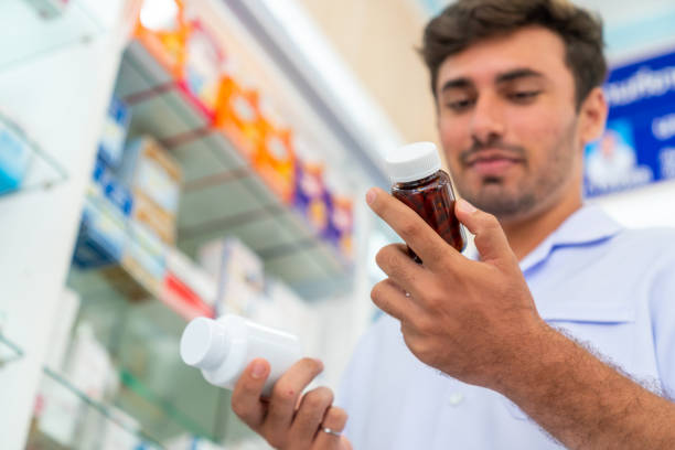 istock Indian man pharmacist working at modern pharmacy 1424479587