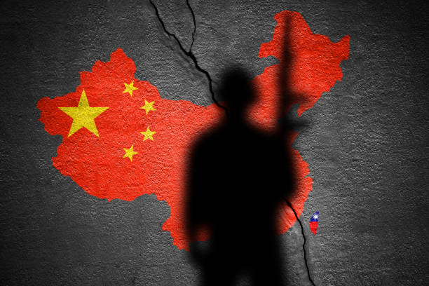 istock China and Taiwan flag map painted on a concrete wall with soldier shadow 1424481613