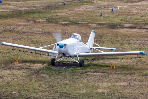 istock White aircraft for spraying agricultural fields at the airfield with a running engine 1424494927