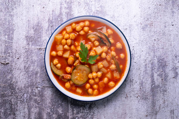 istock Chickpea stew with vegetables. Typical Spanish vegan recipe. 1424496443