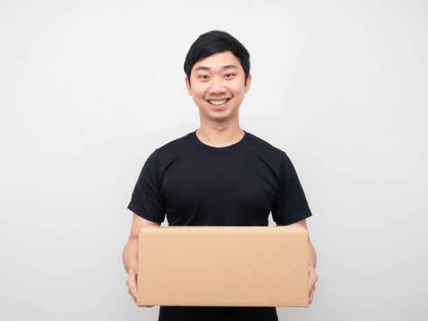 istock Asian man happy smile delivery parcel box 1424508676