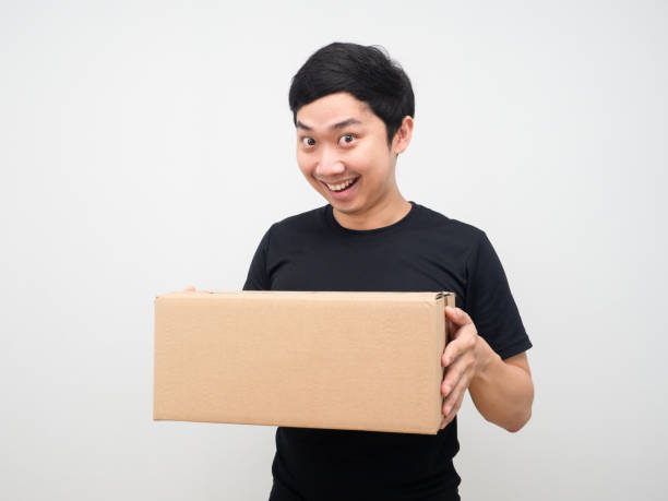 istock Asian man feeling happy with parcel box in hand 1424509069