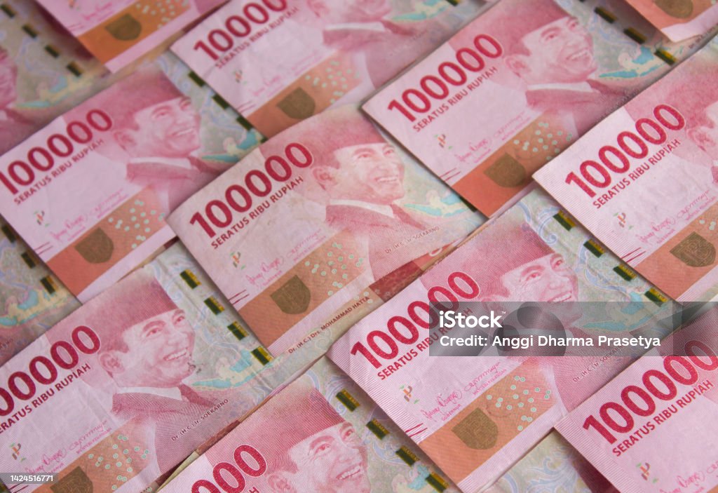 Indonesian rupiah for background. Indonesian rupiah banknotes series with the value of one hundred thousand rupiah IDR 100.000. Adult Stock Photo