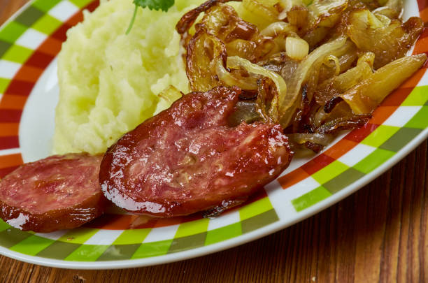 German dish  Himmel und Erde Himmel und Erde - traditional German dish most popular in the regions of the Rhineland, Westphalia and Lower Saxony,  black pudding, fried onions, and mashed potato with apple sauce erde stock pictures, royalty-free photos & images