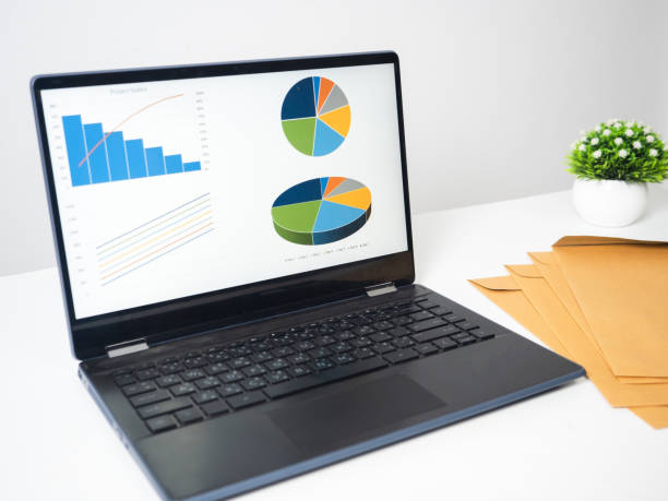 istock Laptop charts graphs business at screen with document on the table copy space 1424522217