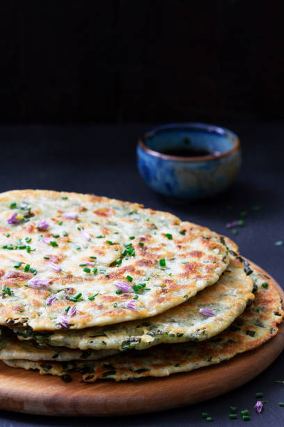 istock Homemade appetizing scallion pancakes served with soy sauce. 1424525000