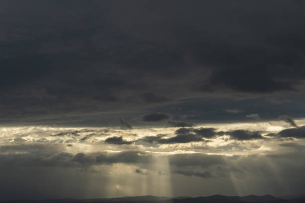 istock the rays of the sun shine through the clouds 1424544426