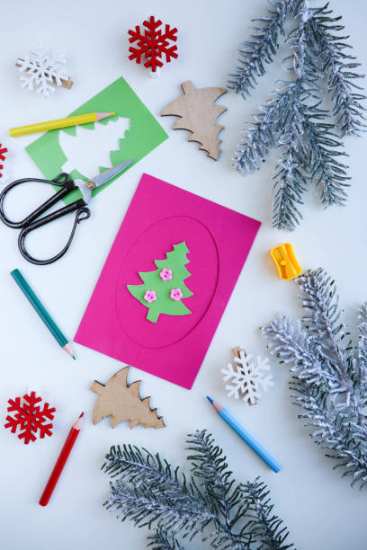 istock making greeting cards for christmas and new year. 1424544480