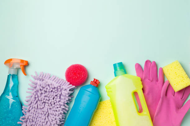istock Many different house cleaning products on color background, top view 1424563454