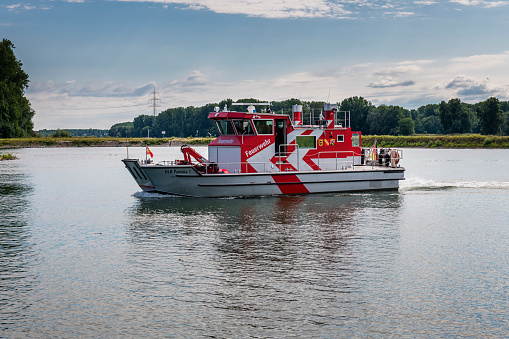 Karlsruhe, Germany - June 26, 2022: Fire ship in Karlsruhe on the Rhine River.