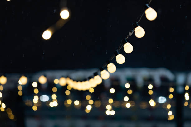 istock blurred background from festive garlands at night 1424566203