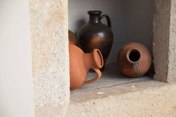 istock Clay pots, stuck in a hole in the wall. 1424567113