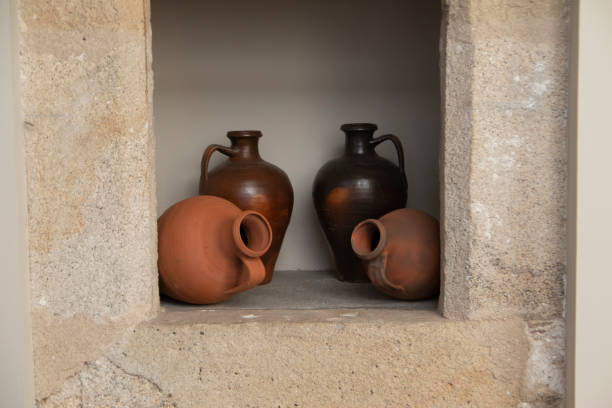istock Clay pots, stuck in a hole in the wall. 1424567134