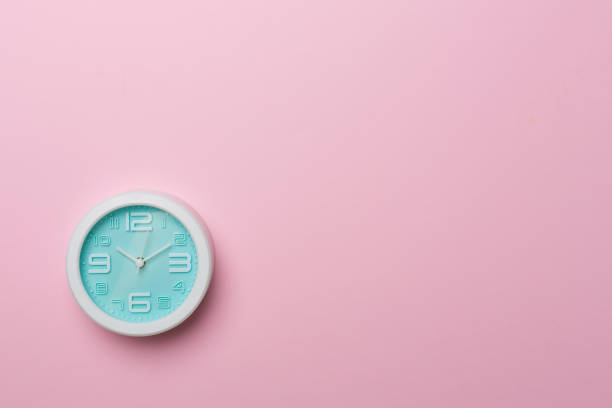 istock Blue clock on color background, top view 1424575611