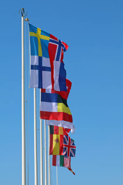 istock international flags on the flagpole waving during the meeting 1424575983