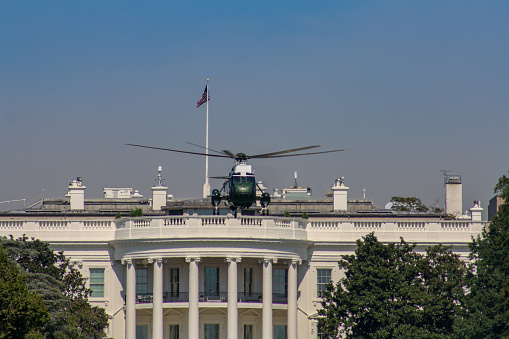 The White House in Washington DC with Marine One in flight