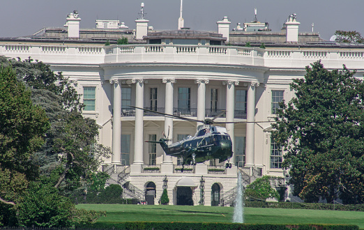The White House in Washington DC with Marine One helicopter taking off