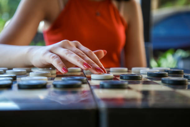 istock A woman plays checkers 1424579094