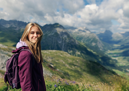 Teenage girl hiking in the beautiful high mountains - Alps, Tyrol, Austria. The girl is looking at the beautiful view.
Canon R5