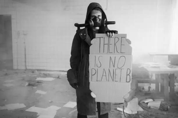 Protest. Global warming. Homemade poster at environmental rally. A homemade sign, saying there is no planet b, survivor in post apocalypse against climate change in the city. black-white