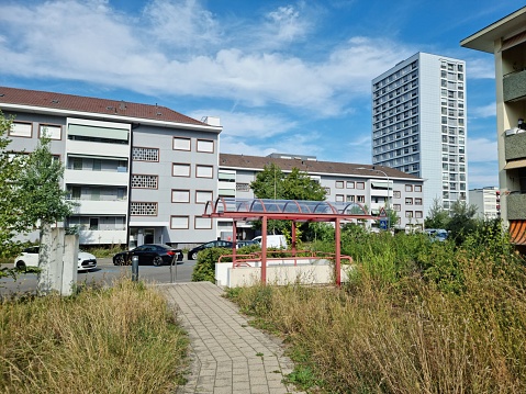 Several residential buildings in the city district Hirzenbach (Zürich). The image was captured during summer season.