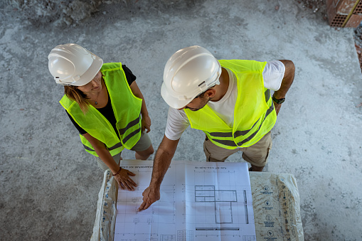 Two architects working together on construction site