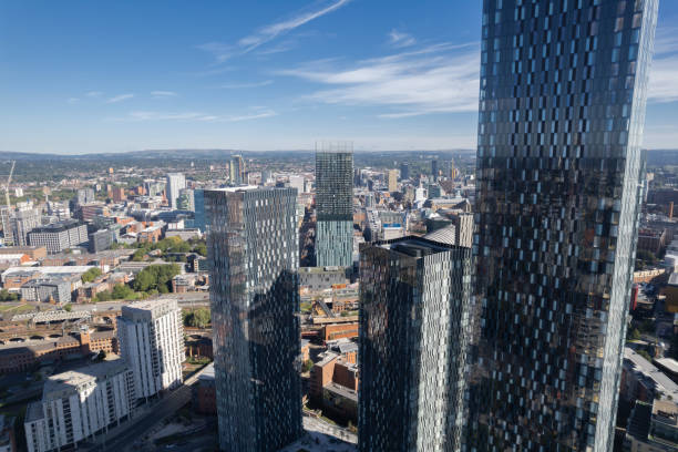 istock Manchester City Centre Drone Aerial View Above Building Work Skyline Construction Blue Sky Summer Beetham Tower Deansgate Square Glass Towers 1424590110