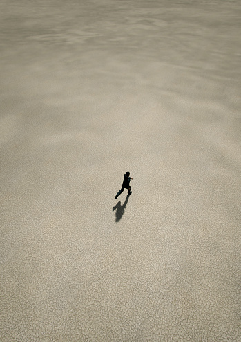 Man in black suit runs in desert. Aerial view. 3D render.