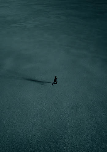 Man in black suit runs in desert at twilight. Aerial view. 3D render.