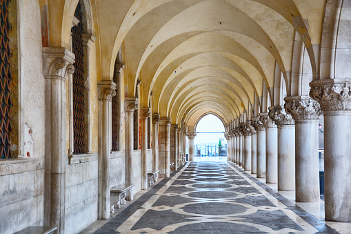 Exterior corridor of Doge's Palace at sunrise in Venice, Italy