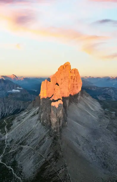 Photo of View from above, stunning aerial view of the Three Peaks of Lavaredo (Tre cime di Lavaredo) during a beautiful sunrise. The Three Peaks of Lavaredo are the undisputed symbol of the Dolomites, Italy.