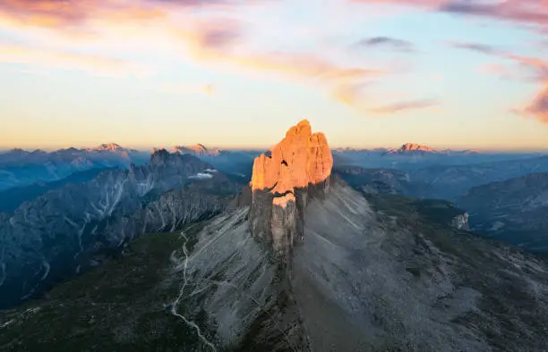 Photo of View from above, stunning aerial view of the Three Peaks of Lavaredo (Tre cime di Lavaredo) during a beautiful sunrise. The Three Peaks of Lavaredo are the undisputed symbol of the Dolomites, Italy.