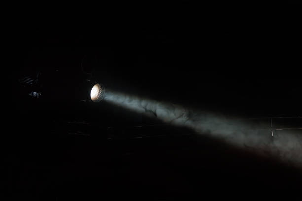 istock theater spotlight with smoke trail 1424601365