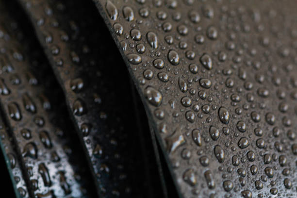 istock Water droplets on the rubber membrane. Waterproofing...  Close-up selective focus area. 1424601746