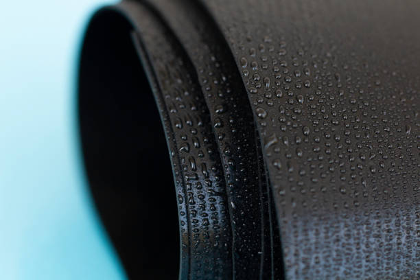 istock Water droplets on the rubber membrane. Waterproofing...  Close-up selective focus area. 1424602470
