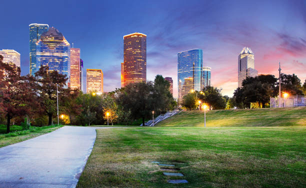 istock Houston Texas Skyline with modern skyscrapers and blue sky view from park river US 1424602971