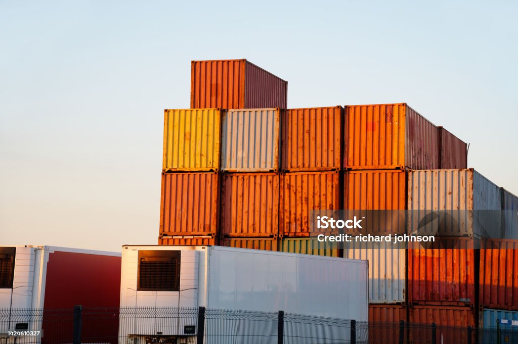Cargo containers stacked high at logistics port town of Greenock Cargo containers stacked high at logistics port town of Greenock UK Cargo Container Stock Photo