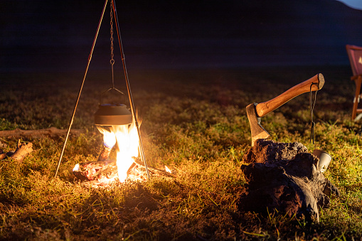 Preparing food on campfire