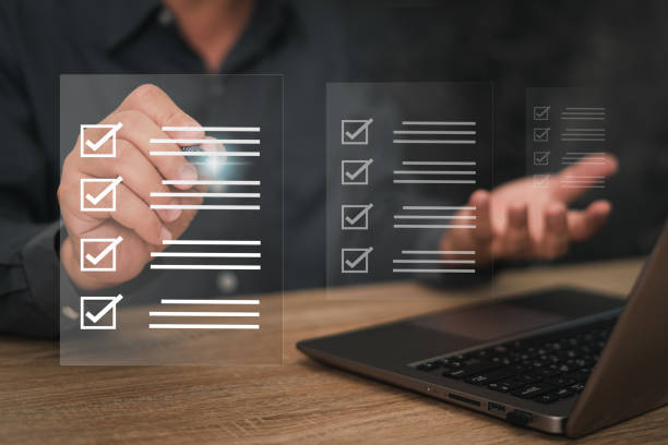 istock Electronic smart checklist document on virtual screens concept, business people check electronic documents on digital documents, paperless office, future business contract signing. 1424615436