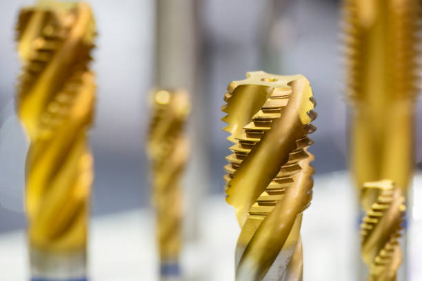 istock Close-up scene the special tapping tools for CNC milling machine. 1424615593