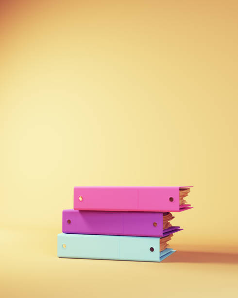 istock Stack of Ring Binder Documents in Pink Purple Blue Beige Studying Back to School Concept 1424616184