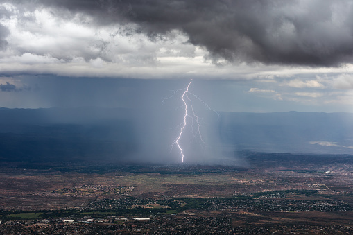 Dark thunderstorm over the city at night