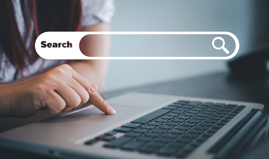 Searching Browsing Internet Data Information with blank search bar. man's hands are using smartphone and keyboard to Searching for information. Using Search Console with your website.