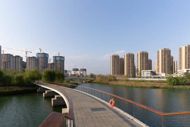 istock Bridge on the lake and modern urban architecture 1424619494