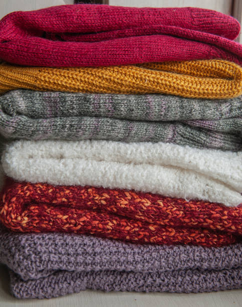 istock Autumn and winter background with knitted colourful sweaters 1424624277