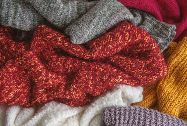istock Autumn and winter background with knitted colourful sweaters 1424626871